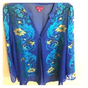 Sheer blue blouse with flower designs